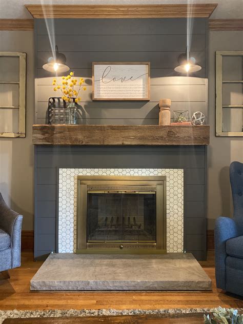 fireplace with shiplap above